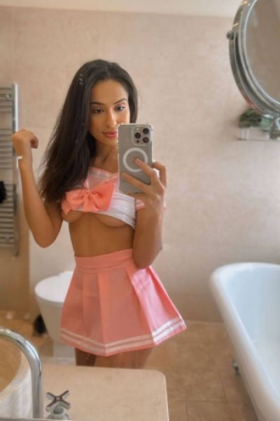 Luisa is wearing a sexy pink outfit in this picture 