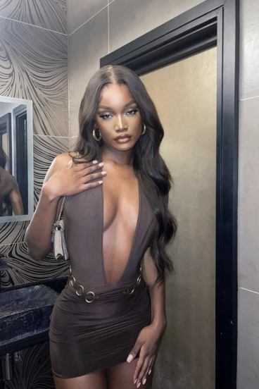 Elam looks very sexy in a dark coloured dress