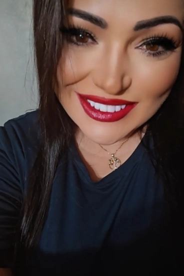 Elegant close-up of Hope, busty brunette escort with soft hazel eyes