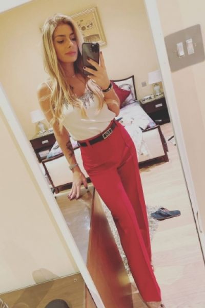 Ada looks great her red trousers and white top 