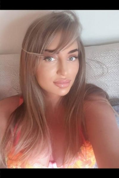 Bambi is wearing a orange bikini in this selfie
