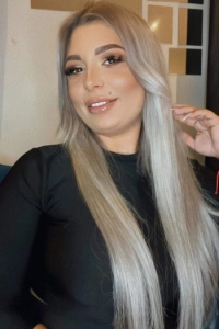 Blonde escort Jude is wearing a black jumper in this selfie 