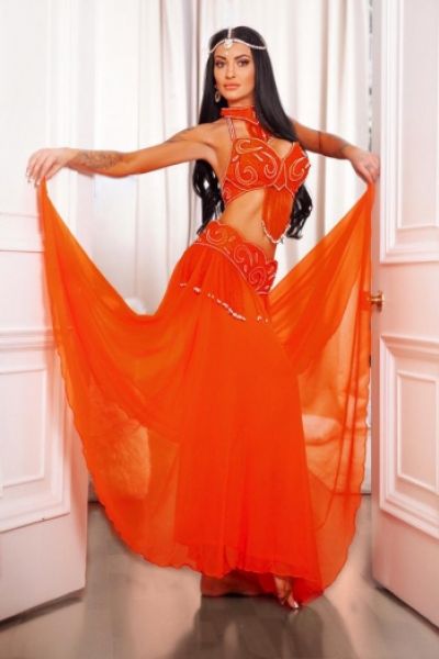 Chantel is wearing a orange dress and is looking very sexy 