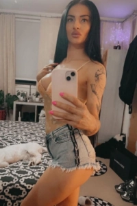 Chantel is wearing jean shorts and a bra 