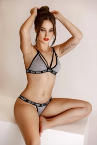 In this picture Dalia is dressed in grey underwear 