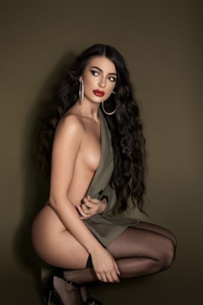 Kendal is naked in this photo with a blazer covering her boobs 