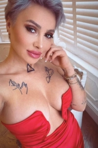 Nikyta looks amazing in a low cut red dress 
