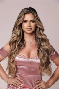 Head shot photo of a very good looking young blonde escort 