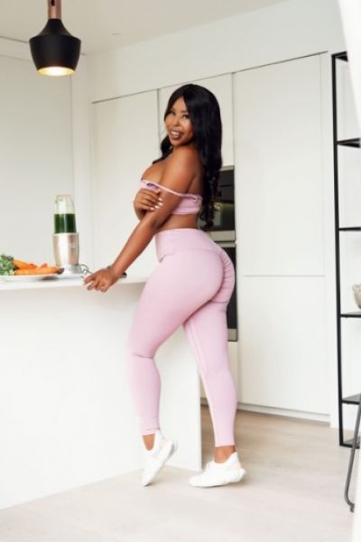 A very sexy black lady in tight pink leggings