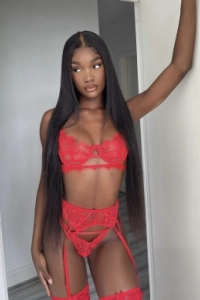 A very sexy young black London escort dressed in red lace underwear 