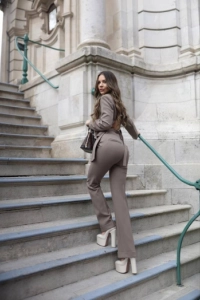 Brunette high class escort Erika looks amazing in a trouser suit 