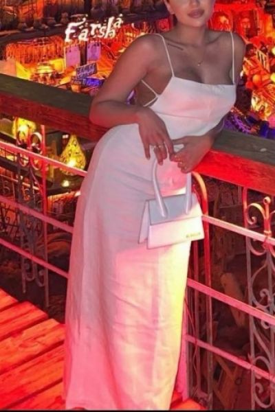 Nuru looks sexy in a long white dress 