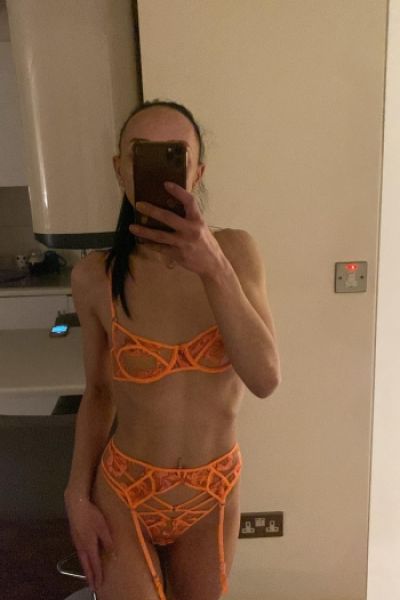 A mirror selfie of Nicole in her underwear 