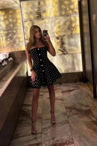 Selfie of high class escort Chardonnay wearing a dress and sexy high heels 