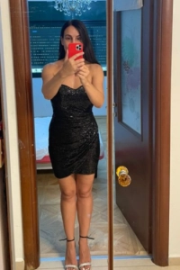 Brunette Escort from Ukraine Yana dressed in high heels  