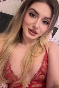 Alma looks very sexy wearing a red lace bra 