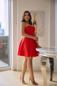 Brazilian escort dressed in red for a dinner date 