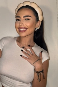 Beautiful brunette escort Kimy is smiling in this selfie 