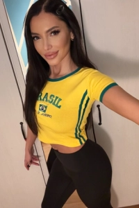 Top reviewed London escort Kylie looks very sexy wearing yellow