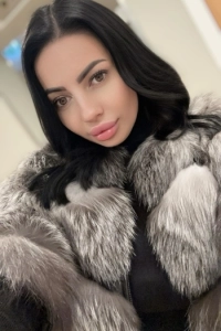 A selfie of a brunette escort named Azzura 