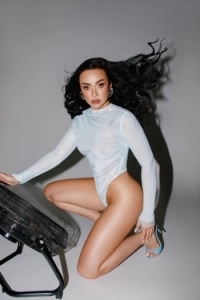 Julie looks sexy wearing a white basque and open toed fuck me heels 