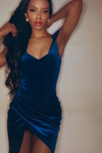 Ebony London escort wearing a blue dress 
