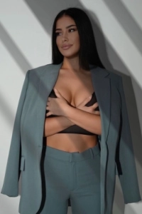Aliya is dressed in a business casual style 