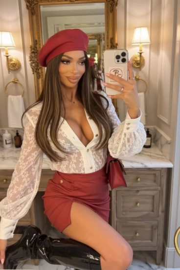 Selfie of Riley wearing a red hat 