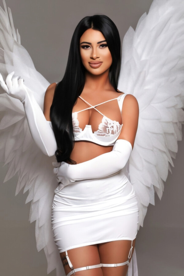 Busty brunette angel in white gloves and lingerie
