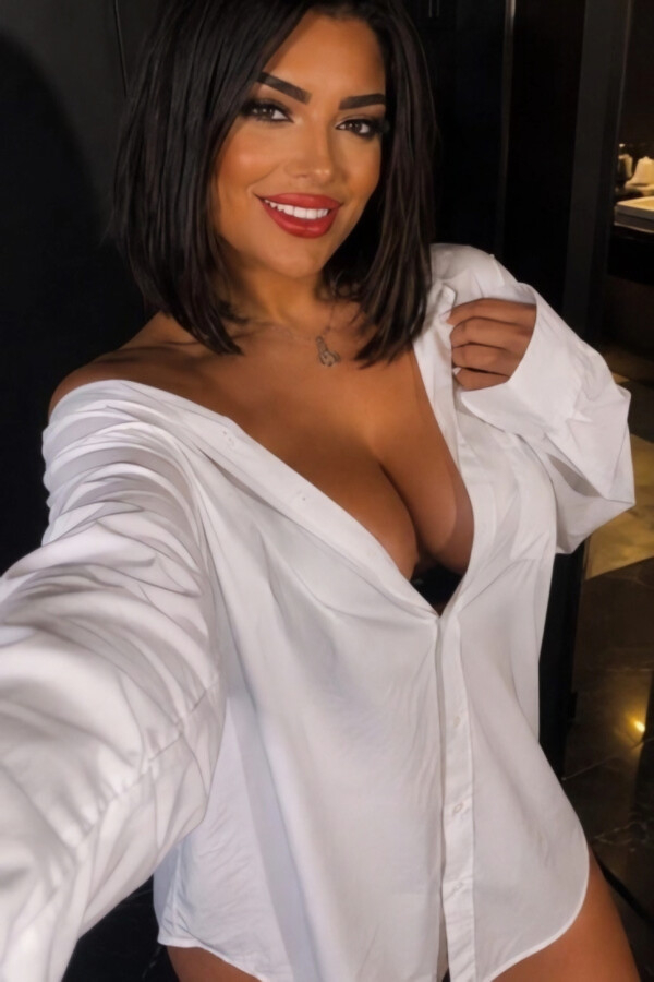 Hope taking a selfie in an oversized white shirt