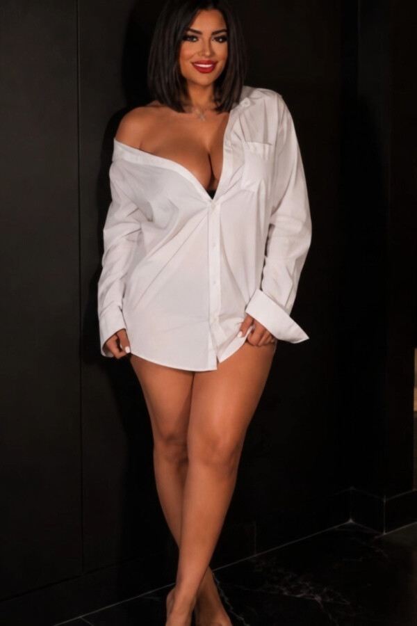 Hope wearing an oversized white shirt over black lingerie