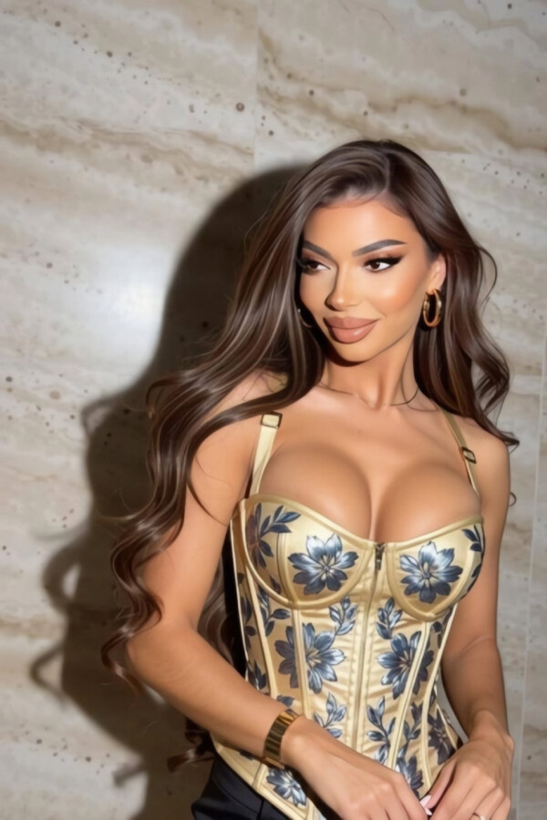 Riley is pictured wearing a very sexy low cut top that pushes her boobs up