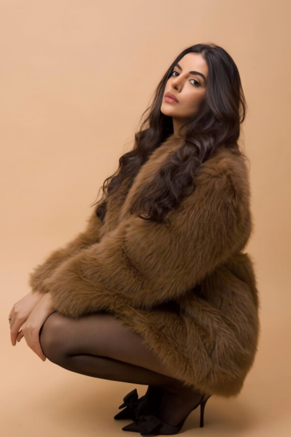 Brunette woman crouching down