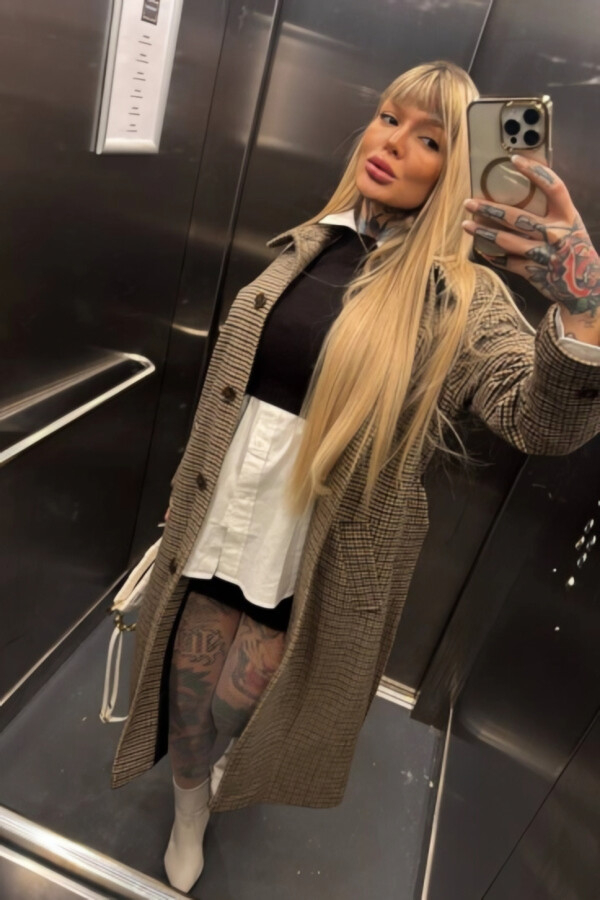 Elevator selfie of a sexy blonde named Lara Seven